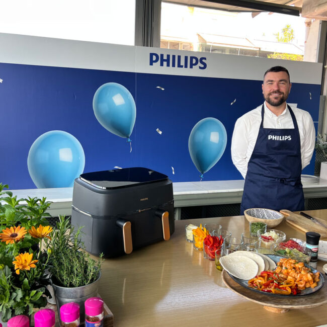 Gabriel Nikolaidis cooking with Philips Airfryer at 15-year celebration event in Athens